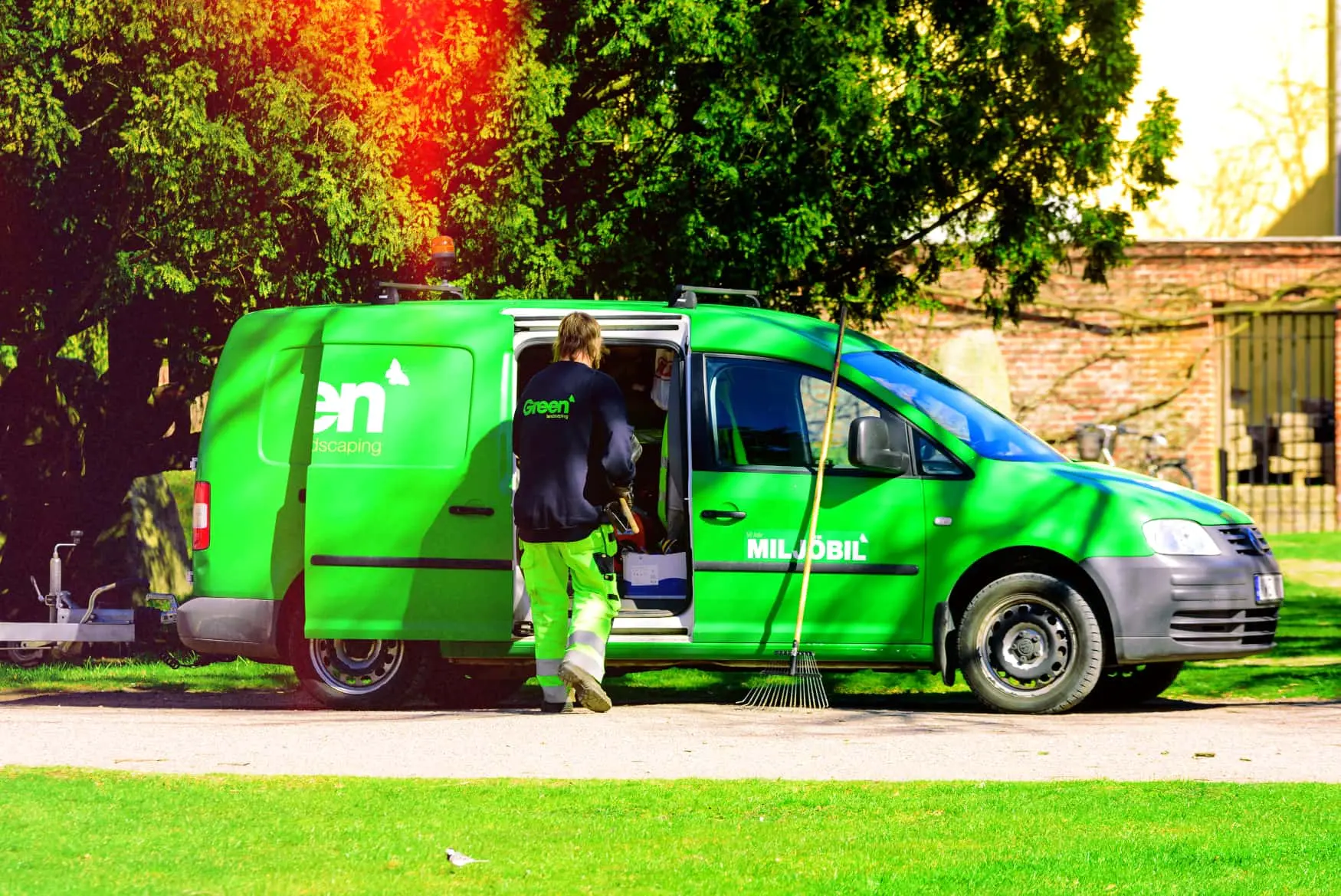 Landscape maintenance van with equipment showing van tracking benefits