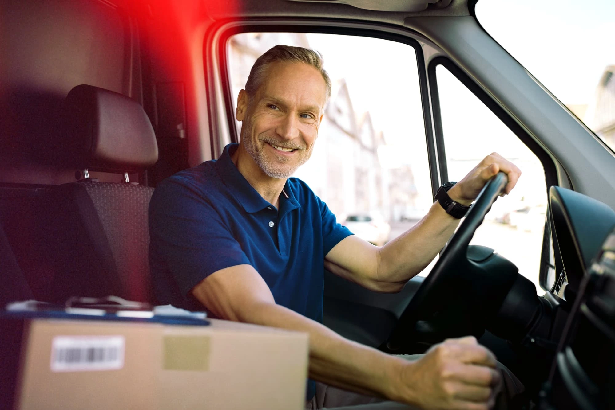 Courier driver with delivery van showing van tracking benefits